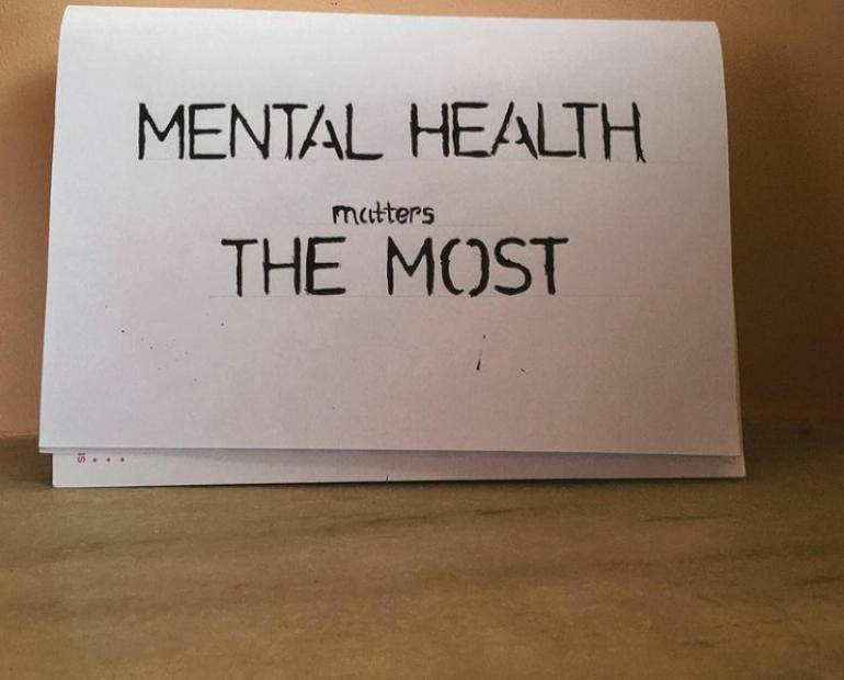 The picture of a sign that says "mental health matters the most"