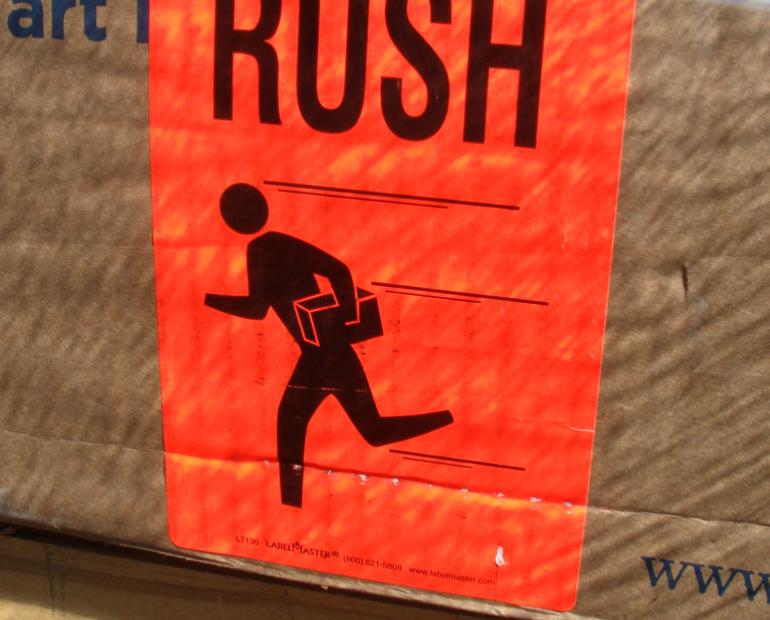 Sign of a stick person running with text above that reads 'RUSH'