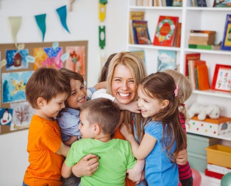 Teacher and children sharing a transparent and healthy relation 