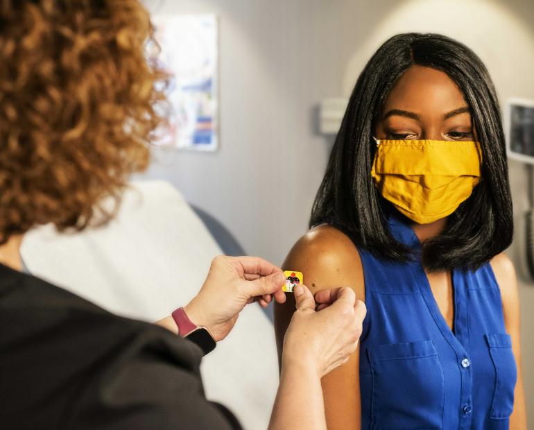 A woman getting a shot.