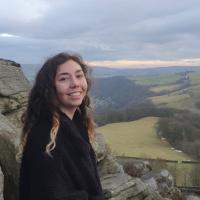 Smiling girl with countryside in the background