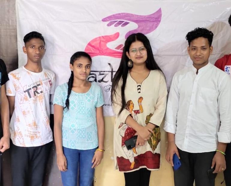 Students of Jazbaat Foundation standing with Founder Arpita Chowdhury