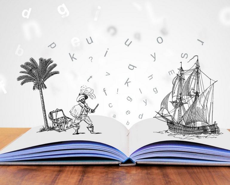 Book with illustrations and letters coming out of the page, showing the story coming to life.