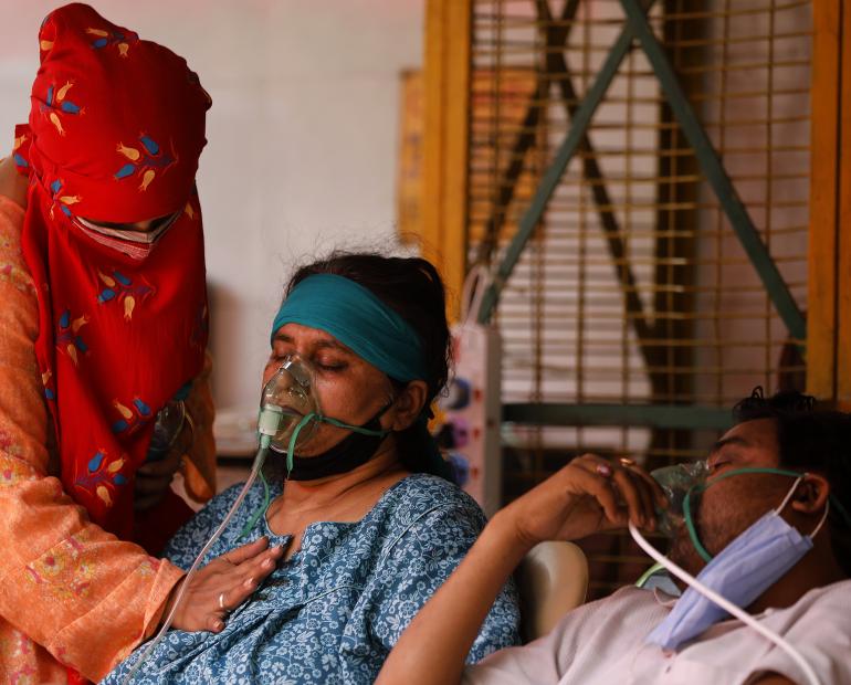 On 2 May 2021, people suffering from breathing difficulty receive oxygen assistance at a Gurdwara, a place of assembly and worship for Sikhs, in Ghaziabad, in the Indian state Uttar Pradesh.