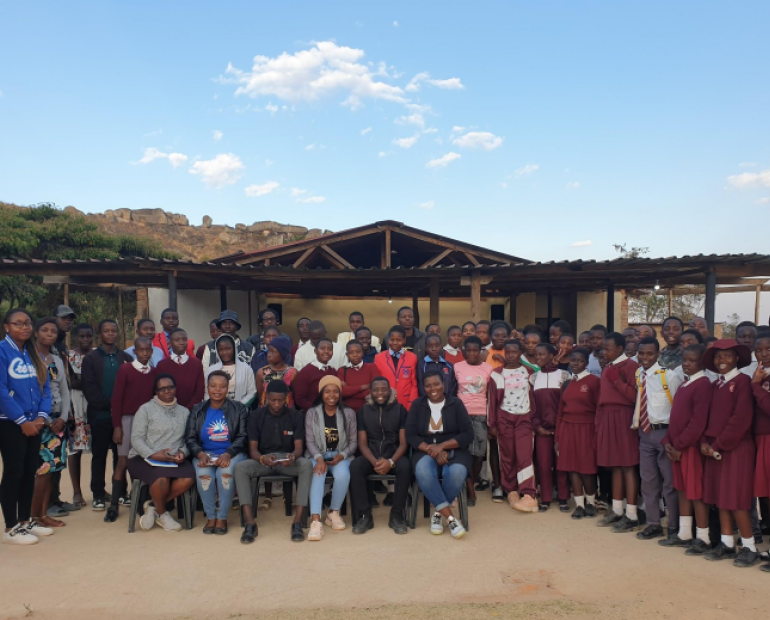 A group of young people pose for the camera.