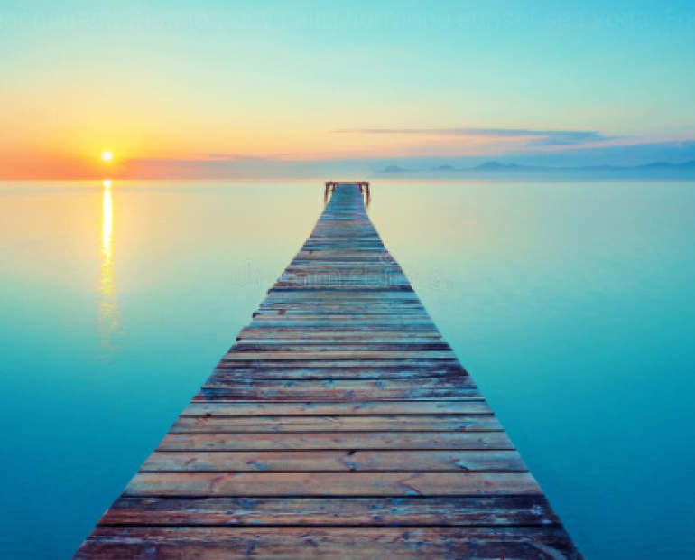 A board walk in a light blue ocean, above a light blue and yellow sky, with the sun to the west