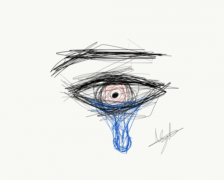 The eye of a man with a tear drop falling out.